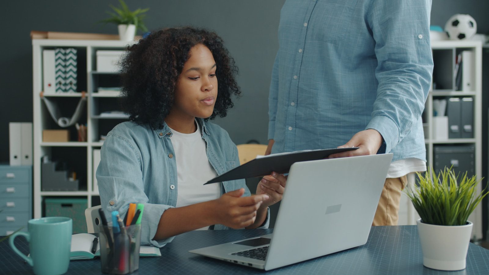 Professionals reviewing compliance documentation in a bright workplace